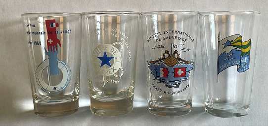 small white wine glasses featuring the general meeting of the Lac Leman rescue company (author’s collection)